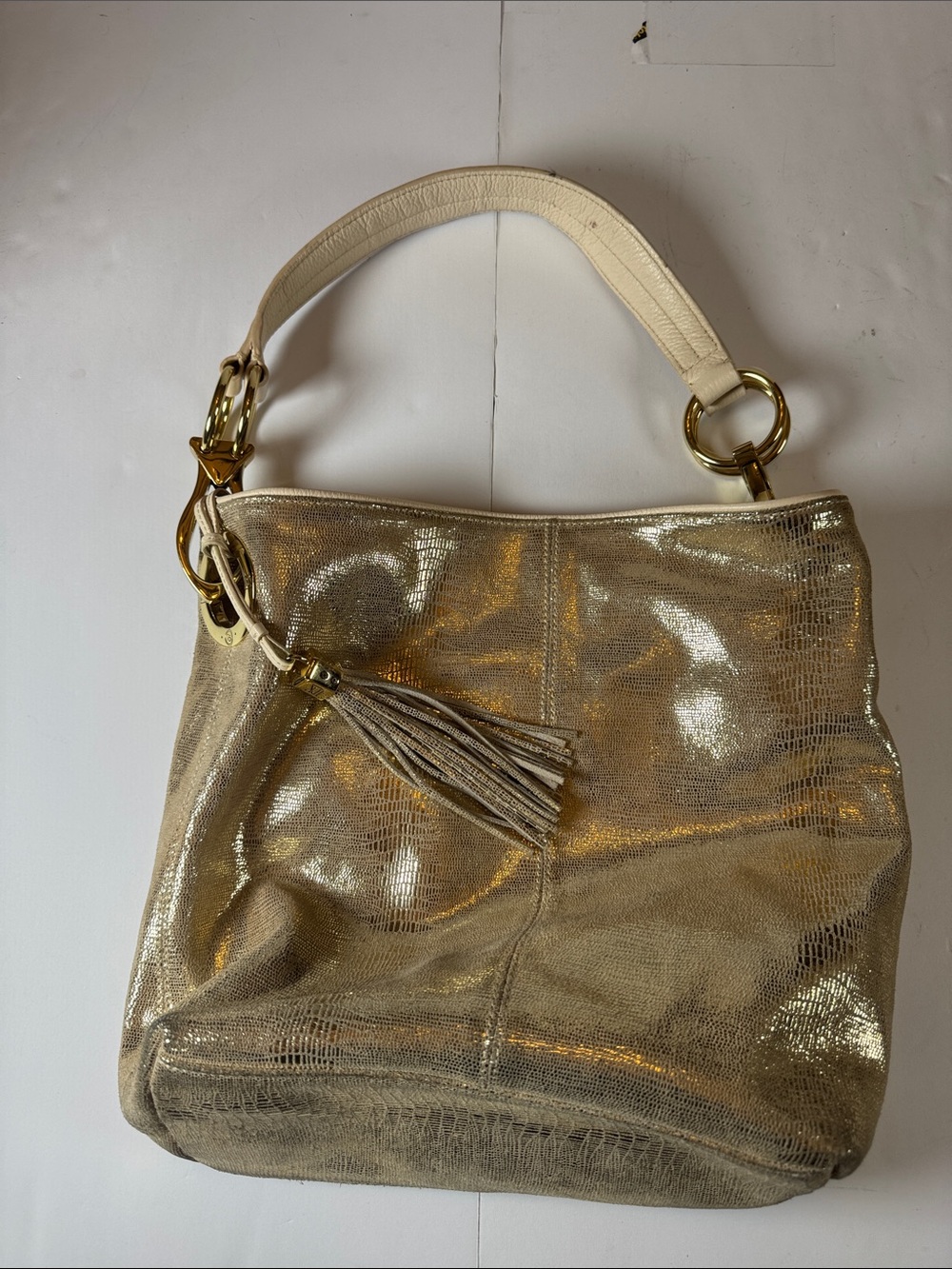 Shimmery Gold Shoulder Bag with Tassel Accent